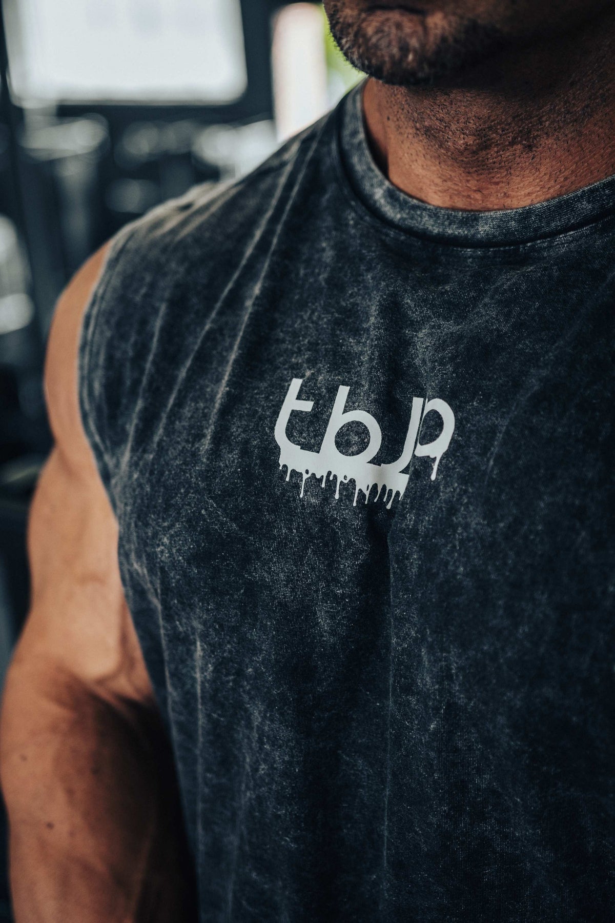 tbJP Drip Logo Vest in Black with a Light Grey Logo