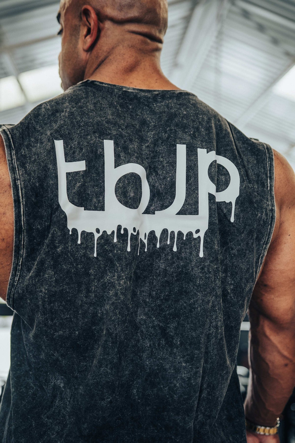 tbJP Drip Logo Vest in Black with a Light Grey Logo