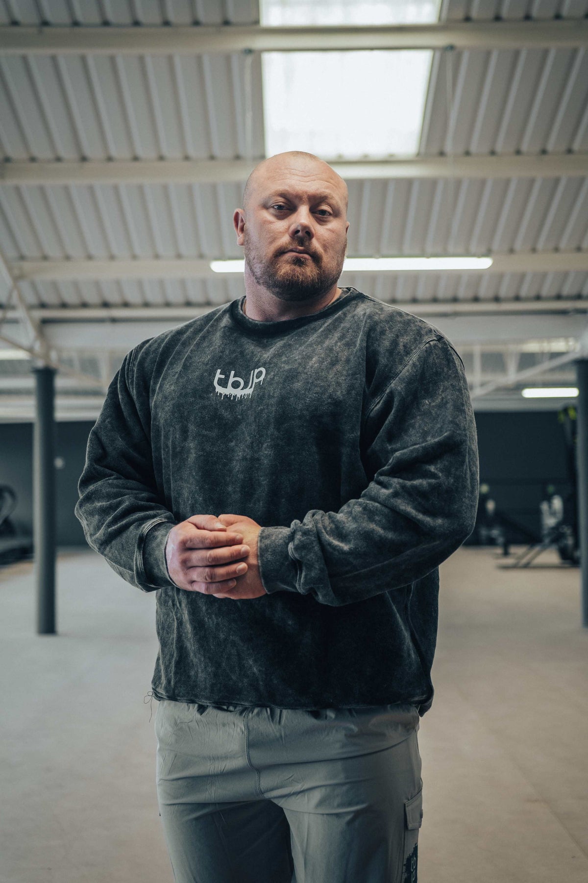 tbJP Drip Logo Sweater in Black with a Light Grey Logo