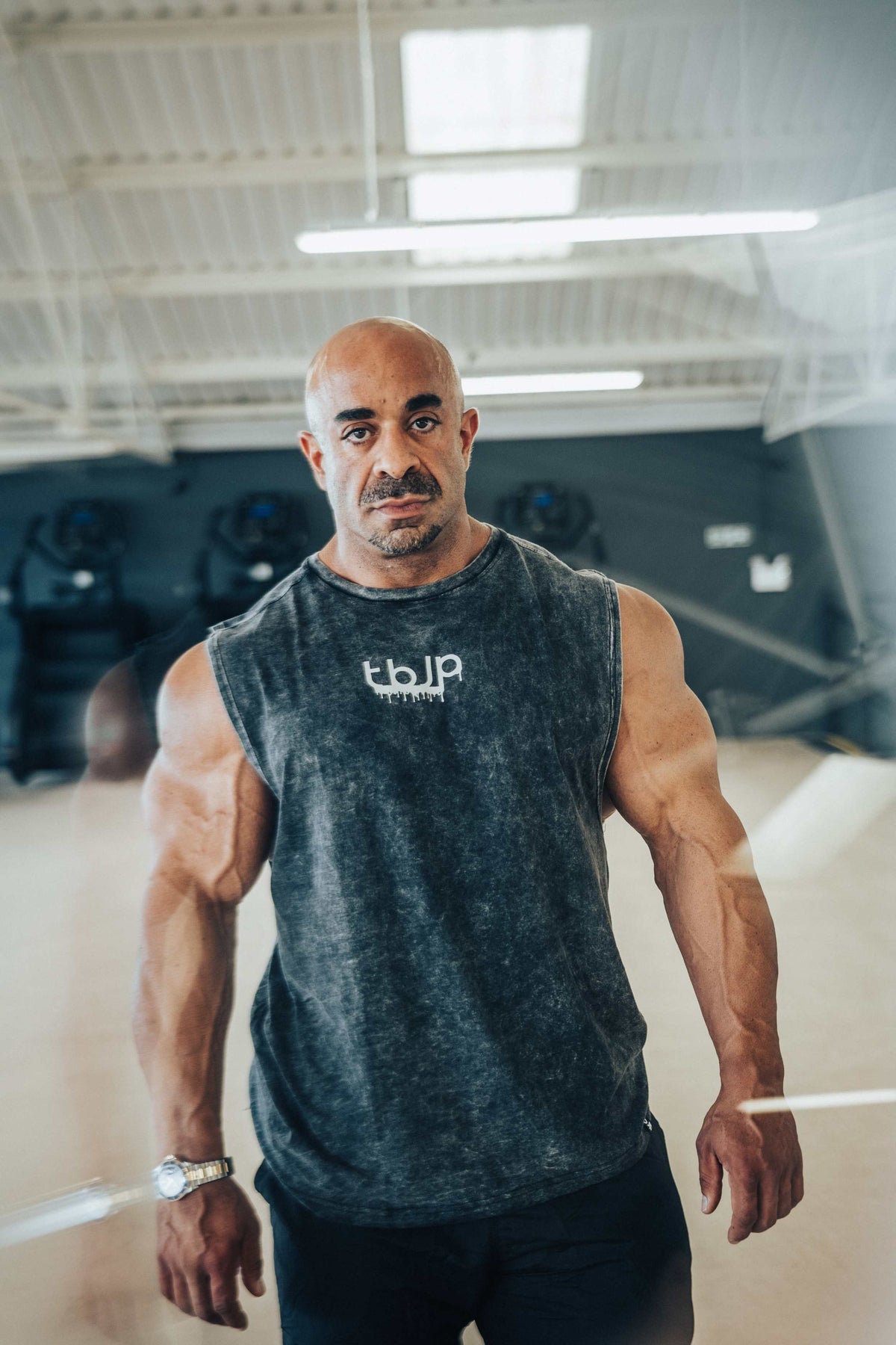 tbJP Drip Logo Vest in Black with a Light Grey Logo