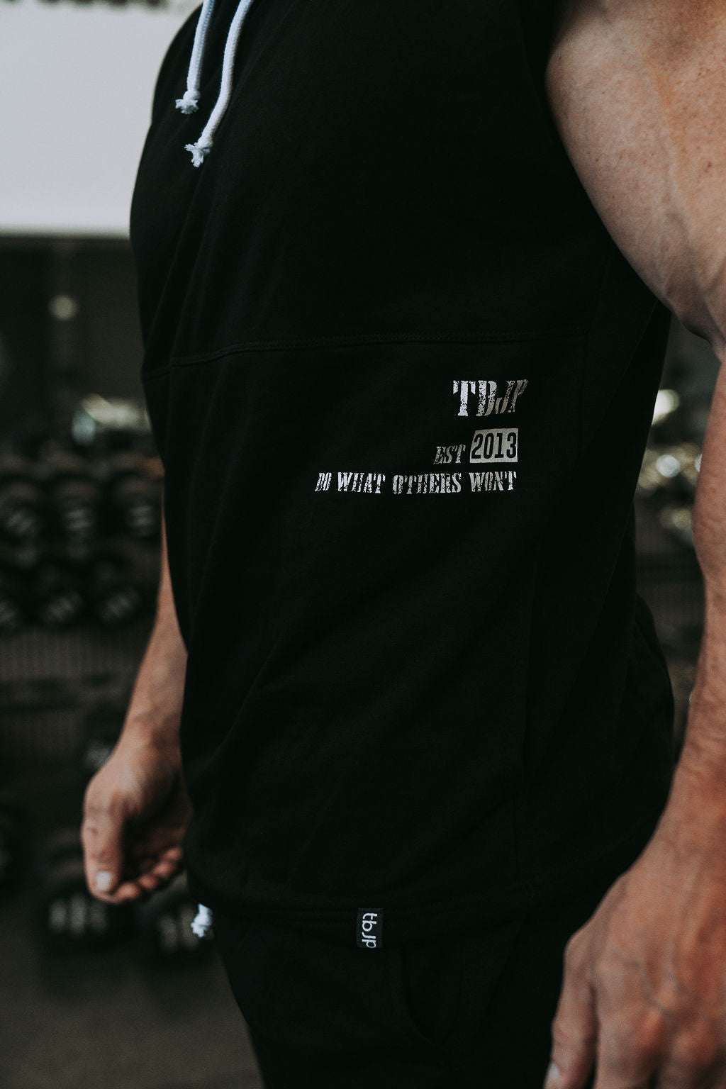 Do What Other Wont Sleeveless Hoodie in Black