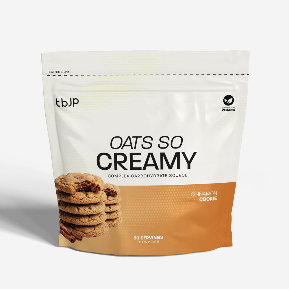 tbJP Oats So Creamy complex carbohydrate source in Cinnamon Cookie flavor, featuring a white and orange design with a stack of cookies on the front.