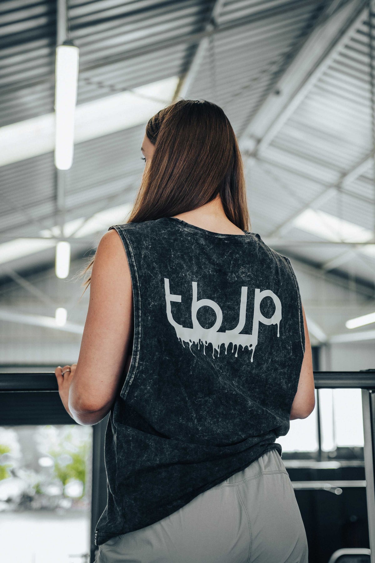 tbJP Drip Logo Vest in Black with a Light Grey Logo