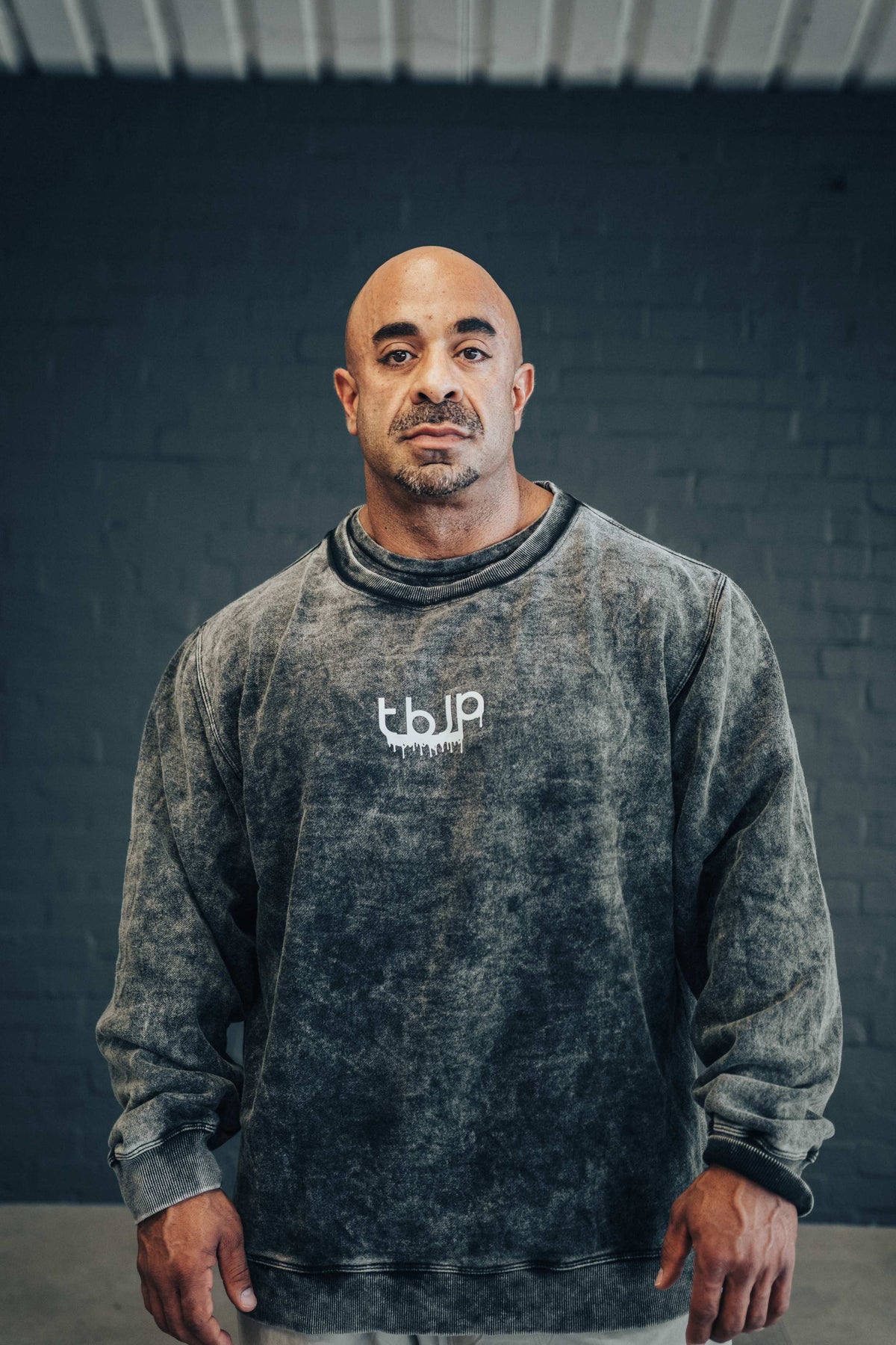 tbJP Drip Logo Sweater in Black with a Light Grey Logo