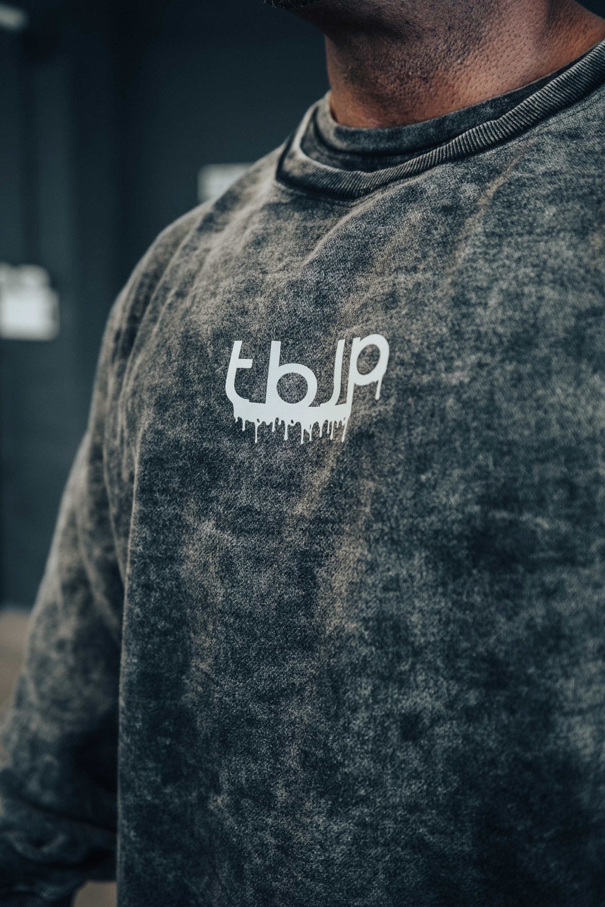 tbJP Drip Logo Sweater in Black with a Light Grey Logo