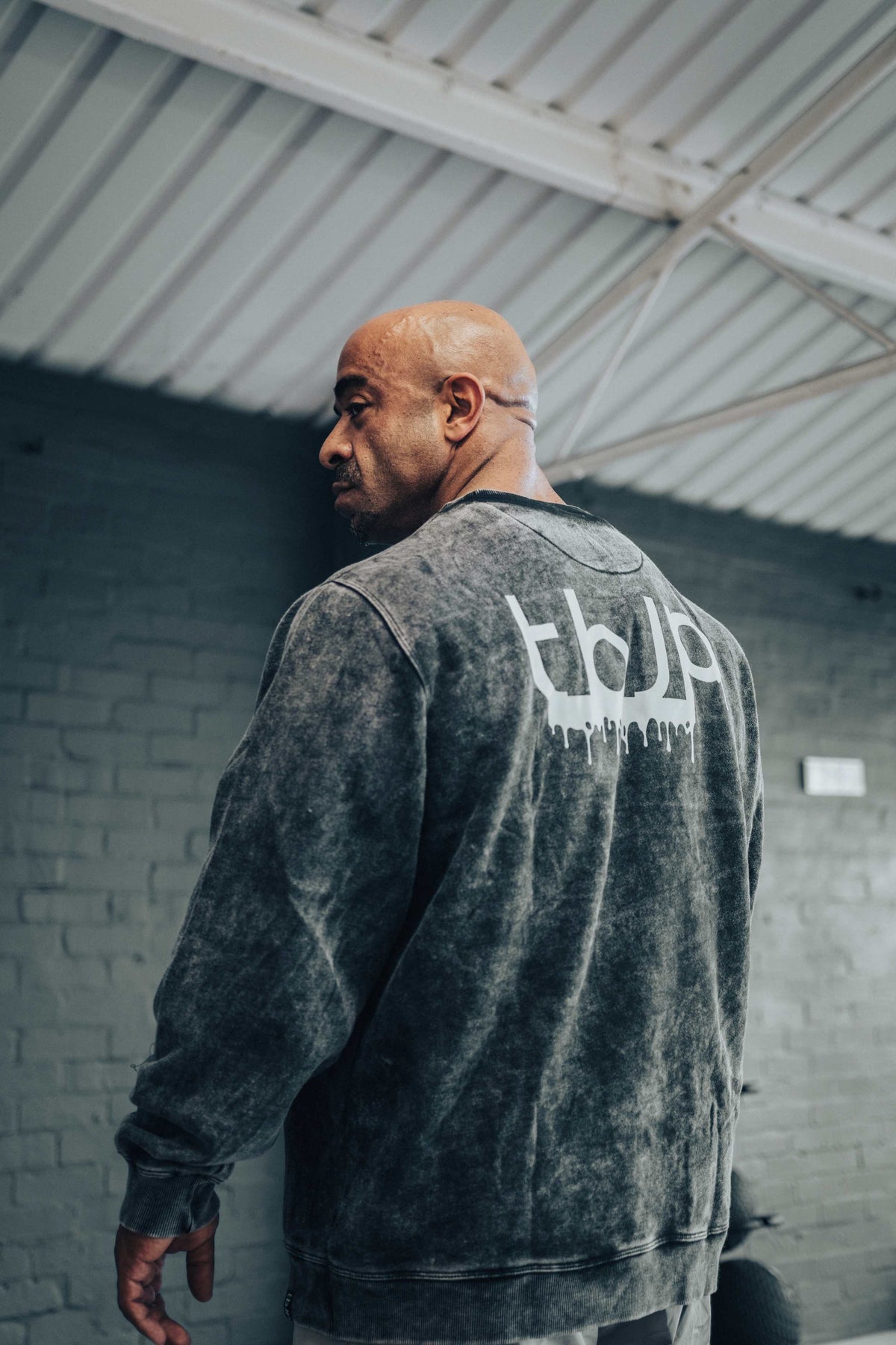 tbJP Drip Logo Sweater in Black with a Light Grey Logo