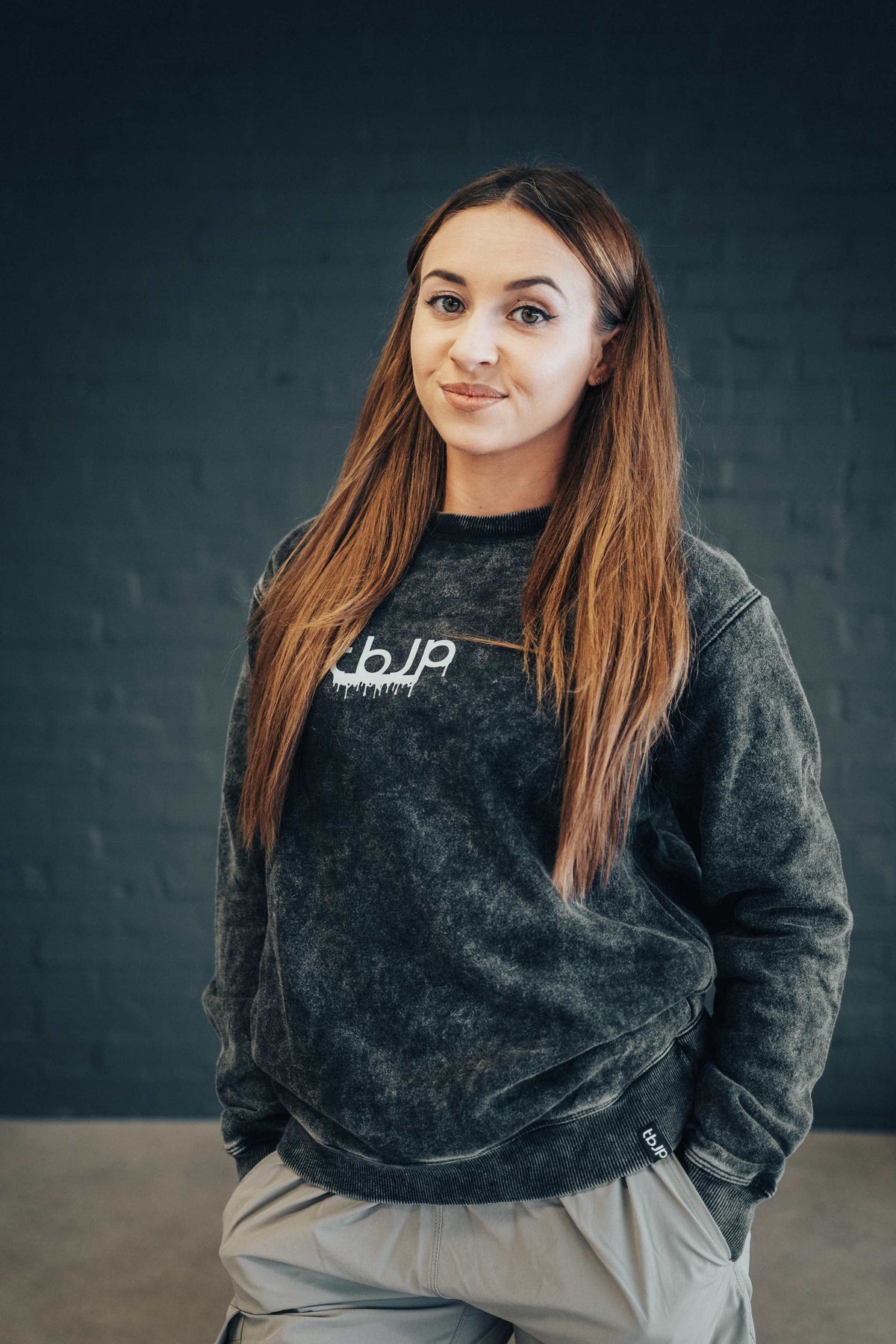 tbJP Drip Logo Sweater in Black with a Light Grey Logo
