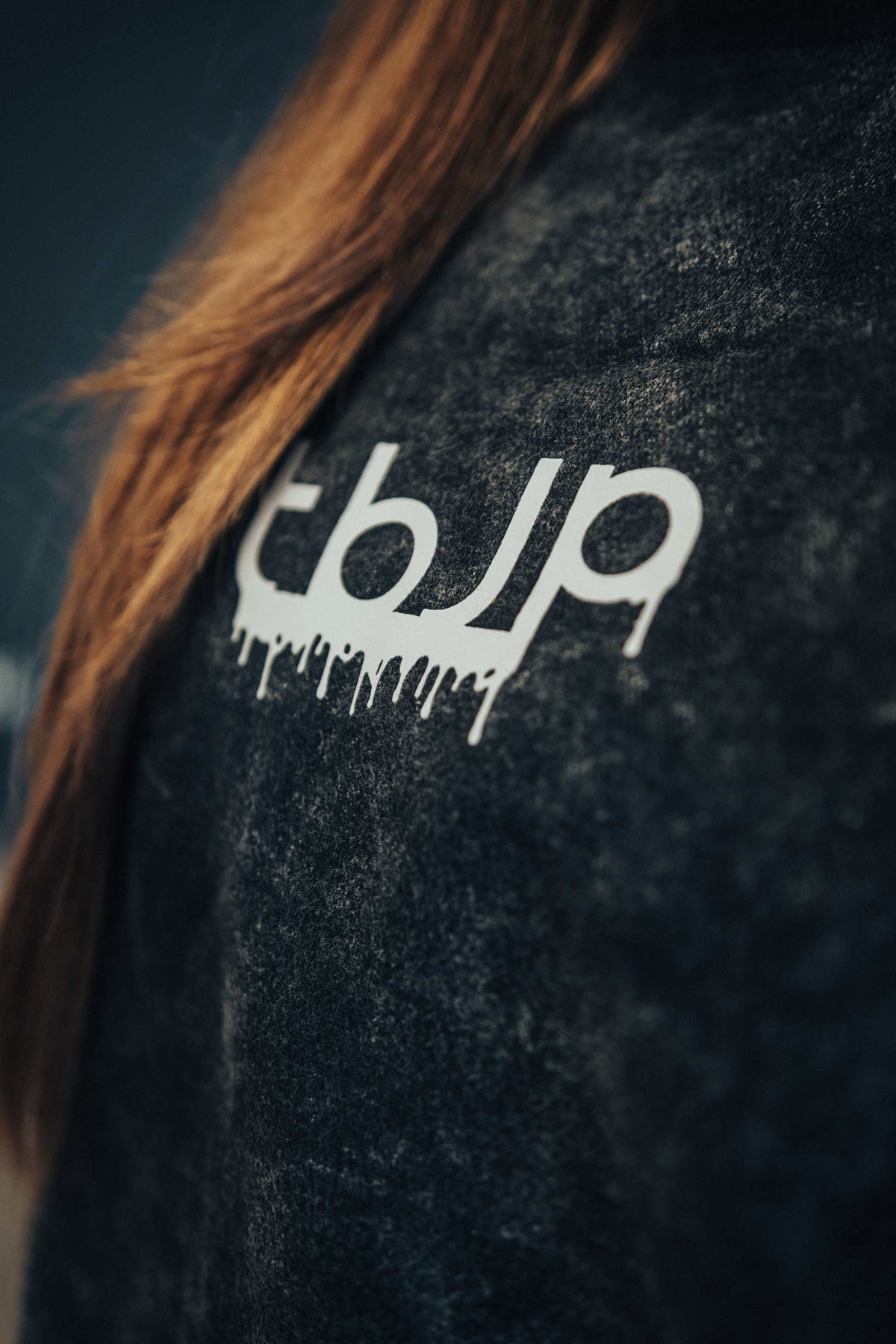tbJP Drip Logo Sweater in Black with a Light Grey Logo