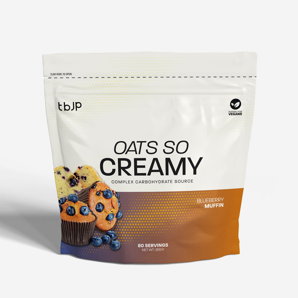 tBJP Oats So Creamy complex carbohydrate source in Blueberry Muffin flavor, featuring blueberry muffin imagery on a white and orange-brown gradient package.