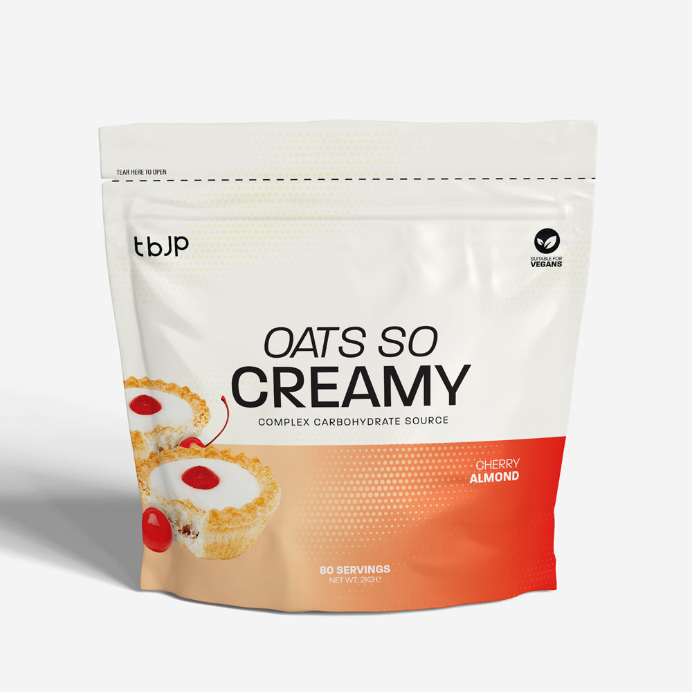tbJP Oats So Creamy complex carbohydrate source in Cherry Almond flavor, featuring a white and orange design with a cherry pastry illustration.