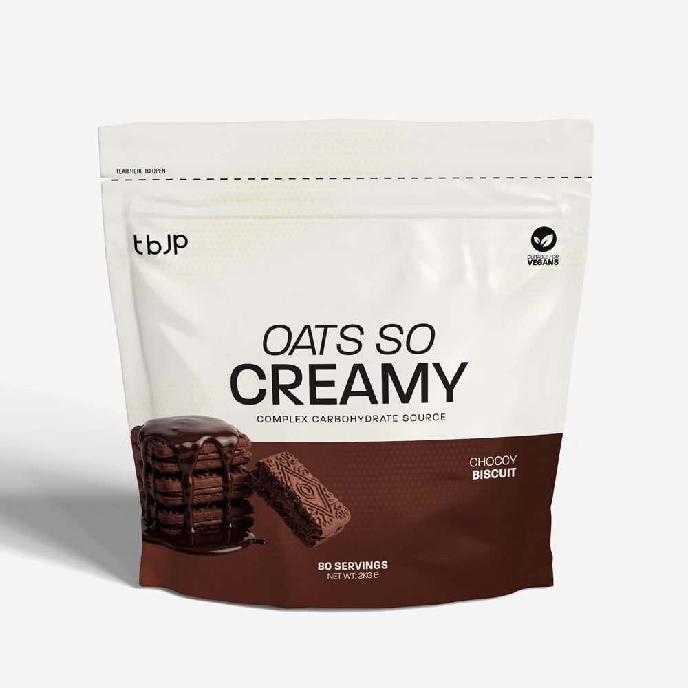 tbJP Oats So Creamy complex carbohydrate source in chocolate biscuit flavor, featuring a brown and dark brown design with an image of a creamy chocolate biscuit stack on a light gray background.
